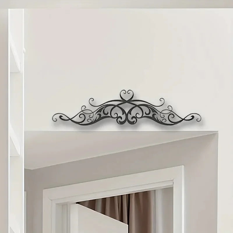 A Vintage-Style Symmetrical Patterned Metal Wall Art Featuring a Scroll with Vine Sculptures